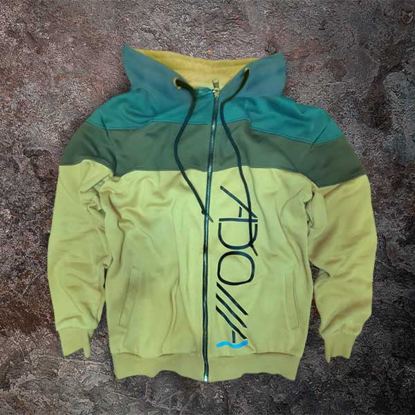 Color-blocked hoodie with ADONAI (Lord) logo on a textured surface