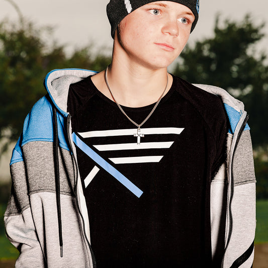 Christian teen wearing a cross and Christian Apparel with zip-up hoodie, beanie, and bamboo tee.
