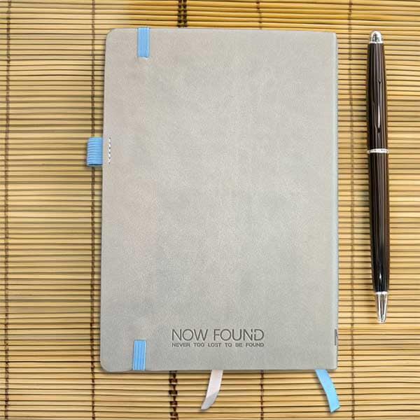 Back of 
Never Too Lost To Be Found Dot Grid Christian Journal on Bamboo with wooden pen