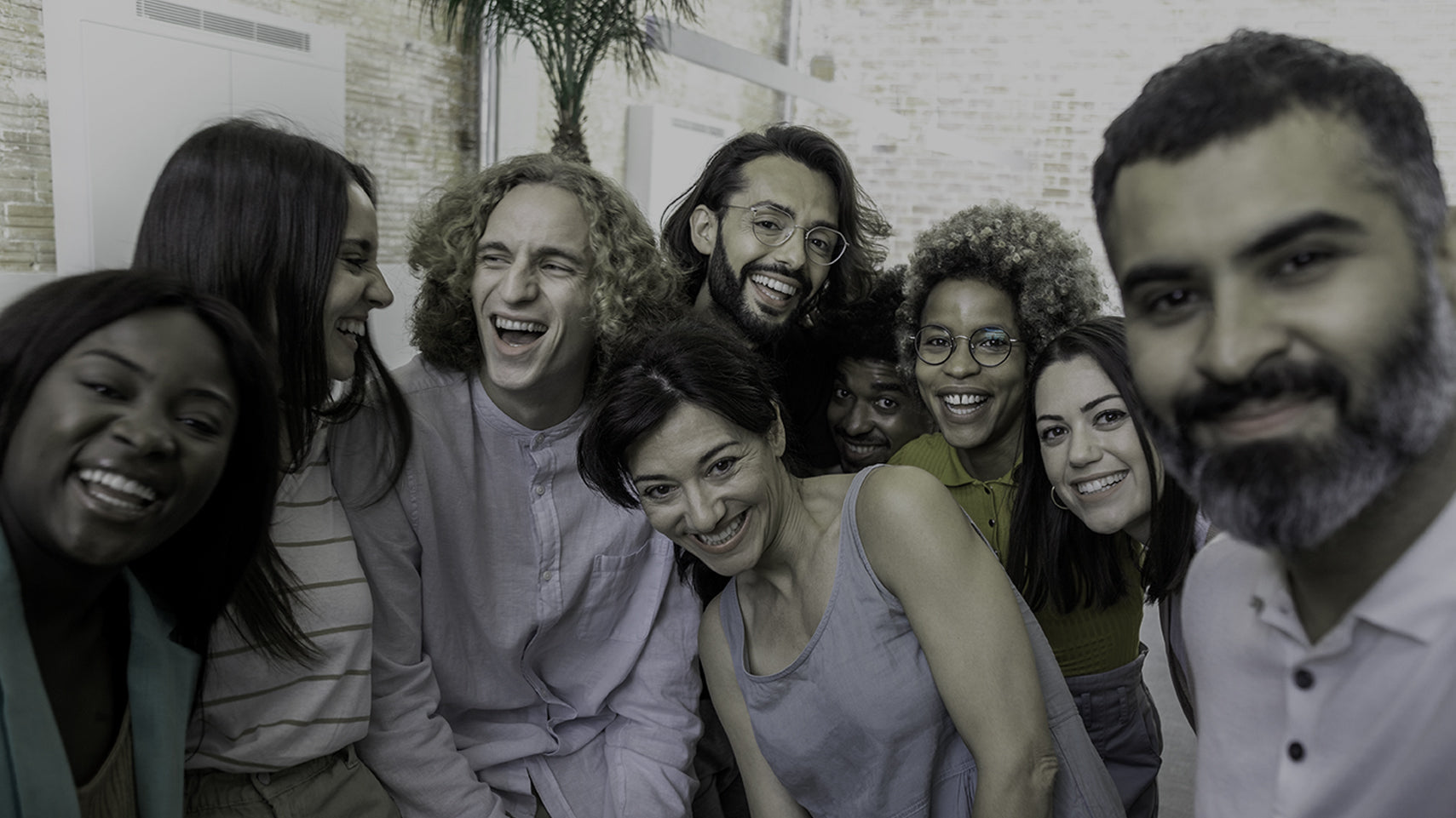 Multi-cultural group of friends laughing and being together even in their differences.
