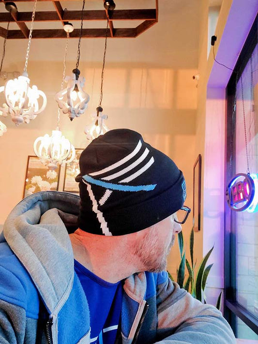 Black I AM beanie with a style bold blue letter "I AM" design knit across folded brim 1134 MVMT patch