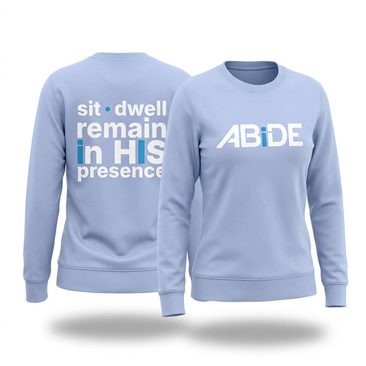 Light powder blue ABiDE sweatshirt with ABiDE on front and sit dwell remain in HIS presence on back on a white background