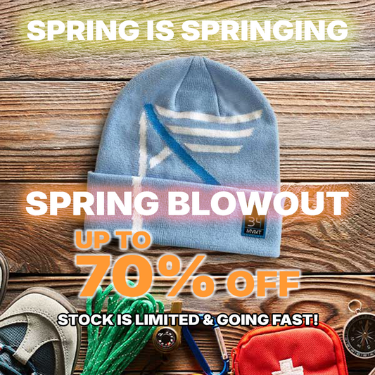 Promotional image with a blue beanie, first aid kit, and other items on a wooden background with text about a spring sale.