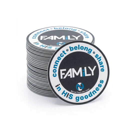 A stack of round grey, blue, and white stickers with blue and white text reading 'FAMiLY - connect • belong • share • in HIS goodness' on a clean white background.