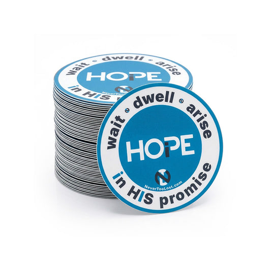 A stack of circular printed stickers with a grey, white, and blue design featuring the word 'HOPE' and the phrase 'wait dwell arise in HIS promise'. One sticker is placed in front of the stack on a clean white background.