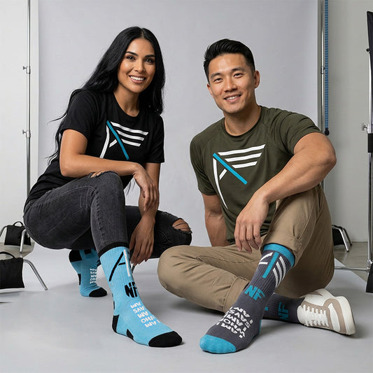 Models wearing Never Too Lost I AM Gray & Blue Sock Variants while wearing green and black bamboo I AM tees