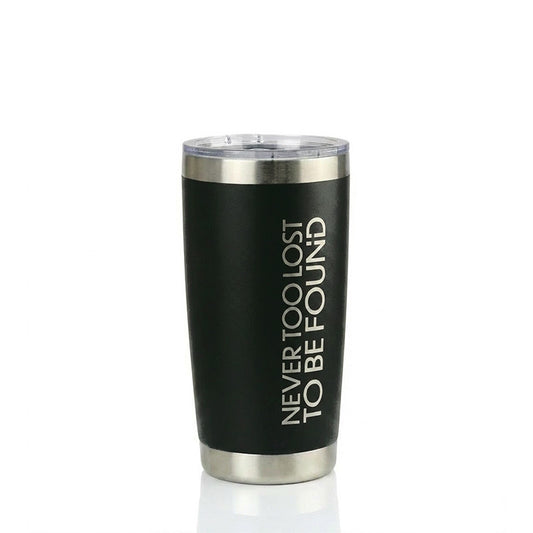 Black tumbler with silver rim and 'NEVER TOO LOST TO BE FOUND' text on a white background