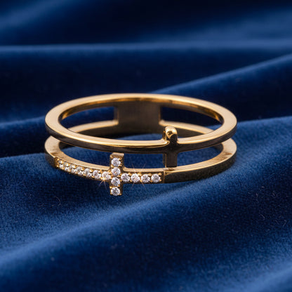 Gold ring with diamond accents on a blue velvet background