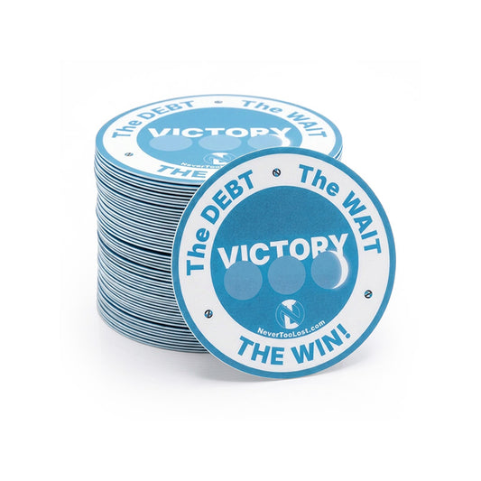 A stack of round blue and white victory stickers with the text 'The DEBT • The WAIT • VICTORY • THE WIN!' on a clean white background.
