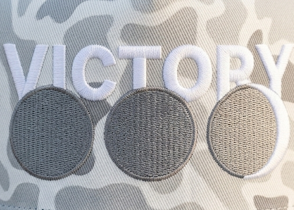 Embroidered 'VICTORY' text with three circles - the Debt, the Wait, the Win on modern gray camo hat