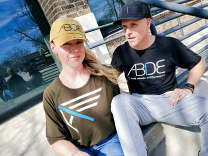 courtney cohen steve cohen wearing now found christian apparel bamboo shirts and abide hats