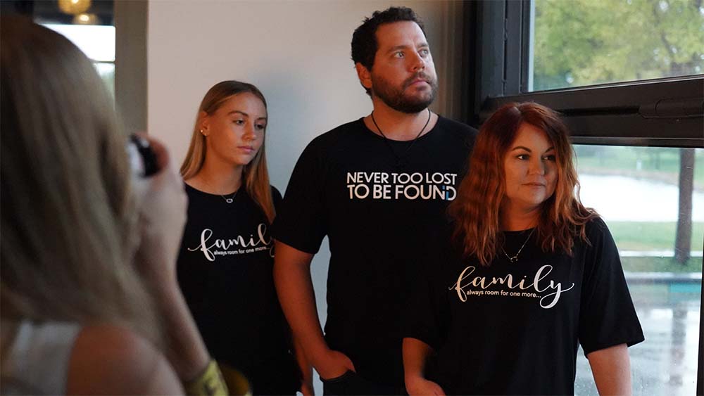 now found apparel, "never too lost to be found" and "family" bamboo shirts on christian family during photoshoot.